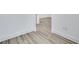 Neutral hallway showing hardwood floors and white trim at 5743 Cr W 750 N, McCordsville, IN 46055