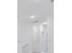 Bright hallway with white walls and trim, featuring several doorways at 5743 Cr W 750 N, McCordsville, IN 46055