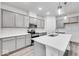 Modern kitchen with gray cabinets, white countertops, and stainless steel appliances at 5743 Cr W 750 N, McCordsville, IN 46055