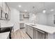 Bright kitchen features stainless appliances, stone countertops, recessed lighting, and gray cabinets at 5743 Cr W 750 N, McCordsville, IN 46055