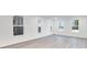 Bright living room with large windows and light wood-look floors at 5743 Cr W 750 N, McCordsville, IN 46055