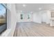 Spacious living room featuring wood-look floors and ample natural light at 5743 Cr W 750 N, McCordsville, IN 46055