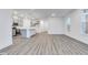Open living space connects to the kitchen with gray cabinets at 5743 Cr W 750 N, McCordsville, IN 46055