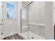 Bright bathroom with a glass-enclosed shower showcasing elegant marble tiling at 5743 Cr W 750 N, McCordsville, IN 46055