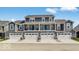 Row of newly built gray townhomes with attached garages, balconies, and well-maintained landscaping at 5743 Cr W 750 N, McCordsville, IN 46055