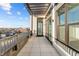 Relax on this spacious balcony with city views, modern metal railings, and overhead pergola at 1155 S Rangeline Rd # 503, Carmel, IN 46032