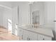 Elegant bathroom featuring a white vanity, marble countertop, and gold-trimmed mirror at 1155 S Rangeline Rd # 503, Carmel, IN 46032