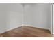 Empty bedroom with wood floors, white walls, electrical outlets and modern trim at 1155 S Rangeline Rd # 503, Carmel, IN 46032