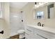 Bright bathroom features a white vanity with modern fixtures and a shower/tub combo at 7635 Grizzly Dr, Nineveh, IN 46164