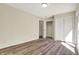 Bedroom features wood floors, closet and access to the laundry room at 7635 Grizzly Dr, Nineveh, IN 46164