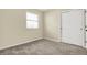 Bedroom featuring neutral carpet, a bright window, and a closet at 7635 Grizzly Dr, Nineveh, IN 46164