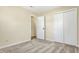 Bedroom featuring neutral carpet, access to another room, and a closet at 7635 Grizzly Dr, Nineveh, IN 46164