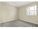 Cozy bedroom with neutral carpet and a bright window at 7635 Grizzly Dr, Nineveh, IN 46164