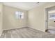 This bedroom features neutral walls, plush carpeting and plenty of natural light from a window at 7635 Grizzly Dr, Nineveh, IN 46164