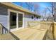 A newly constructed wooden deck features sliding glass doors and a wood railing at 7635 Grizzly Dr, Nineveh, IN 46164