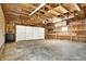 Interior view of detached garage with a white door and storage shelves at 7635 Grizzly Dr, Nineveh, IN 46164