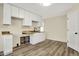 Bright kitchen features white cabinets, a wood countertop, and a modern black faucet at 7635 Grizzly Dr, Nineveh, IN 46164