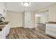 Open-concept kitchen with wood floor and view to the adjoining rooms at 7635 Grizzly Dr, Nineveh, IN 46164