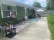 Outdoor patio featuring a seating area and an umbrella table setup at 6438 Doris Dr, Indianapolis, IN 46214
