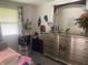 Bedroom features a large mirror, bright window, and decor at 6438 Doris Dr, Indianapolis, IN 46214