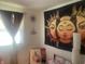 Bedroom with unique tapestry, bright window, and decorative plants at 6438 Doris Dr, Indianapolis, IN 46214