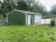 Backyard garage with roll up door and extra side door entry at 6438 Doris Dr, Indianapolis, IN 46214