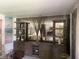 Living room featuring a large entertainment center with shelving and mirrored accents at 6438 Doris Dr, Indianapolis, IN 46214