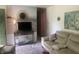 Comfortable living room with modern furniture and a beach-themed wall mural at 6438 Doris Dr, Indianapolis, IN 46214