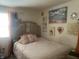 Comfortable bedroom with a plush bed and decorative accents, creating a cozy retreat at 6438 Doris Dr, Indianapolis, IN 46214