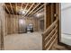 Unfinished basement with exposed framing, offering a blank canvas for customization at 9700 Windy Hills Dr, Zionsville, IN 46077