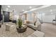 Basement living room with modern decor, a cozy seating area, and a nearby bar at 9700 Windy Hills Dr, Zionsville, IN 46077