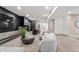 Comfortable basement living area with stylish decor, a modern bar, and adjacent living room at 9700 Windy Hills Dr, Zionsville, IN 46077