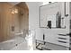 Sleek bathroom features a glass shower, white vanity, modern fixtures, and natural light at 9700 Windy Hills Dr, Zionsville, IN 46077