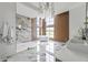 Open bathroom with a soaking tub, marble shower, and sleek vanity at 9700 Windy Hills Dr, Zionsville, IN 46077