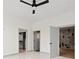 Bright bedroom featuring a ceiling fan, walk-in closet, and ensuite access at 9700 Windy Hills Dr, Zionsville, IN 46077