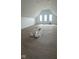 Spacious room with hardwood flooring, and bright natural light from the many large windows at 9700 Windy Hills Dr, Zionsville, IN 46077