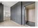 Interior view of modern elevator featuring wood-paneled walls and herringbone-patterned flooring at 9700 Windy Hills Dr, Zionsville, IN 46077