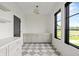 Hallway features large window, base cabinets, and white countertops at 9700 Windy Hills Dr, Zionsville, IN 46077