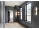 Hallway features detailed trim, modern lighting, and an integrated bookshelf adding character to the home's design at 9700 Windy Hills Dr, Zionsville, IN 46077