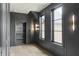 Hallway features detailed trim, modern lighting, and an integrated bookshelf adding character to the home's design at 9700 Windy Hills Dr, Zionsville, IN 46077