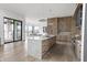 Gourmet kitchen with island, stainless steel appliances, and an adjacent dining area at 9700 Windy Hills Dr, Zionsville, IN 46077