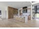 Open kitchen with a spacious island, wood cabinets, and stainless steel appliances at 9700 Windy Hills Dr, Zionsville, IN 46077