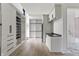 Functional laundry room and walk-in closet with built-in shelving and storage, seamlessly blending utility and organization at 9700 Windy Hills Dr, Zionsville, IN 46077