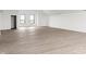 Spacious living room with vinyl floors and abundant natural light at 9700 Windy Hills Dr, Zionsville, IN 46077