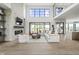 Spacious living room with fireplace, open floor plan, and stylish modern decor at 9700 Windy Hills Dr, Zionsville, IN 46077