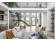 Beautiful open floor plan, modern staircase, and neutral color palette enhance this stunning living space at 9700 Windy Hills Dr, Zionsville, IN 46077