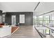 Bright and airy living area with neutral décor, hardwood floors, modern railings and an open concept floorplan at 9700 Windy Hills Dr, Zionsville, IN 46077