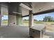 Outdoor patio area with stone columns and outdoor kitchen, offering a perfect space for entertaining at 9700 Windy Hills Dr, Zionsville, IN 46077