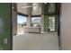 Inviting outdoor kitchen and patio area with stone accents and stylish finishes at 9700 Windy Hills Dr, Zionsville, IN 46077