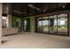 Covered patio with an outdoor kitchen area and large sliding glass doors to the home's interior at 9700 Windy Hills Dr, Zionsville, IN 46077
